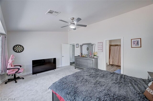 carpeted bedroom with ceiling fan and lofted ceiling