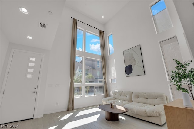 living room with a towering ceiling