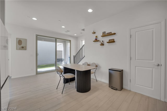 dining space featuring light hardwood / wood-style flooring