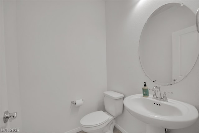 bathroom with sink and toilet