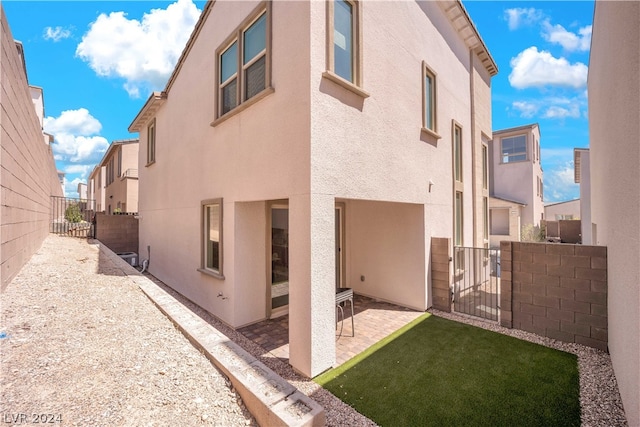 rear view of house with a patio