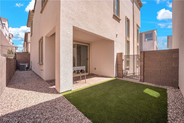 back of house featuring a patio and central AC