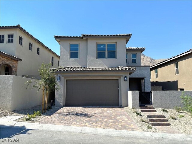 mediterranean / spanish-style house featuring a garage