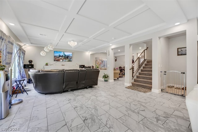 living room featuring coffered ceiling, a chandelier, and light tile floors