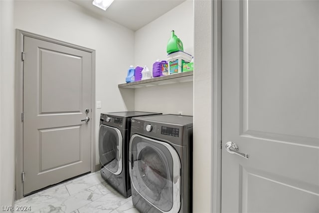 laundry area featuring independent washer and dryer and light tile flooring