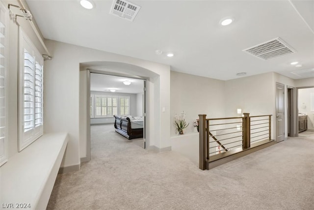 8373 Bartholomew Park Ct, Las Vegas, NV 89139 - hall featuring an upstairs landing, carpet flooring, arched walkways, and visible vents