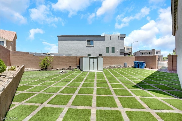 rear view of property featuring a storage shed and a yard