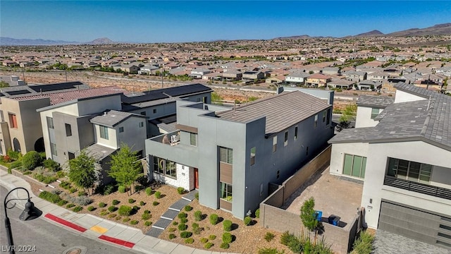 birds eye view of property featuring a mountain view