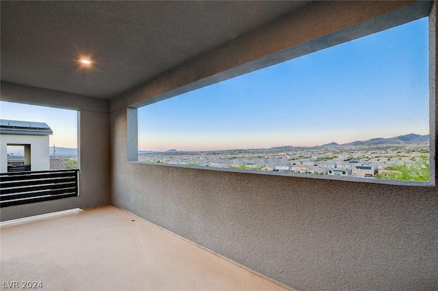 balcony at dusk with a mountain view