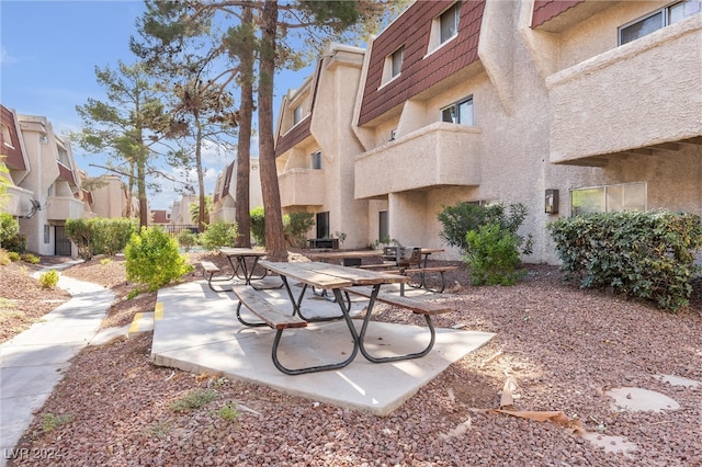 surrounding community with a patio area