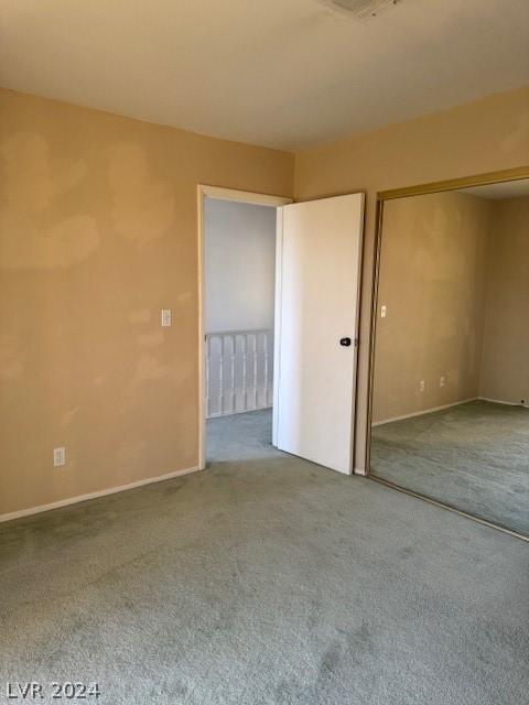 interior space featuring a closet and carpet floors