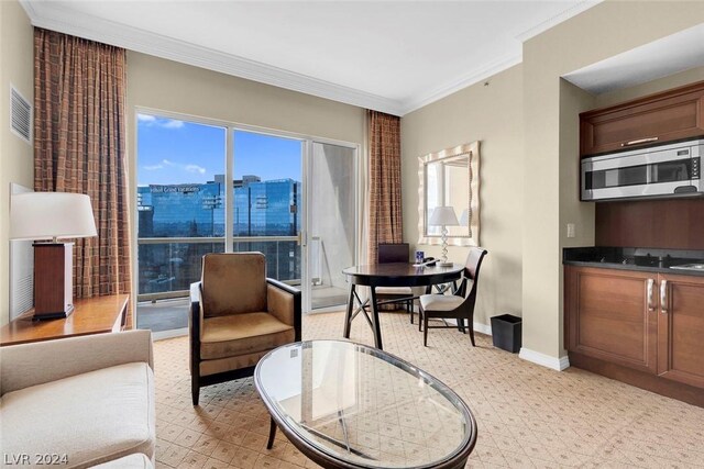 sitting room with crown molding