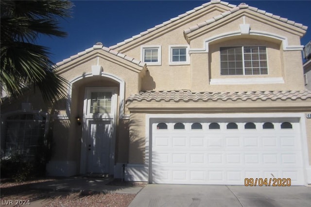 view of front of property featuring a garage