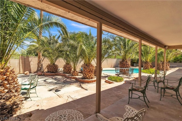 view of patio featuring a fenced in pool