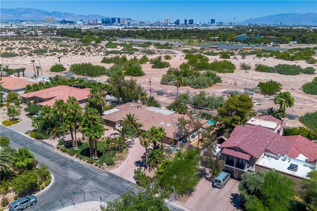 birds eye view of property with a mountain view