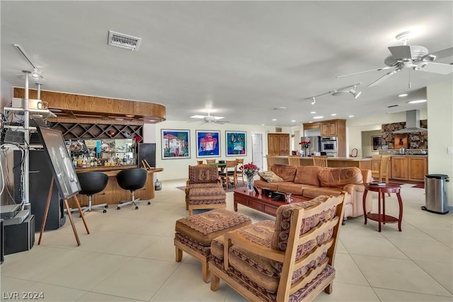 tiled living room featuring ceiling fan