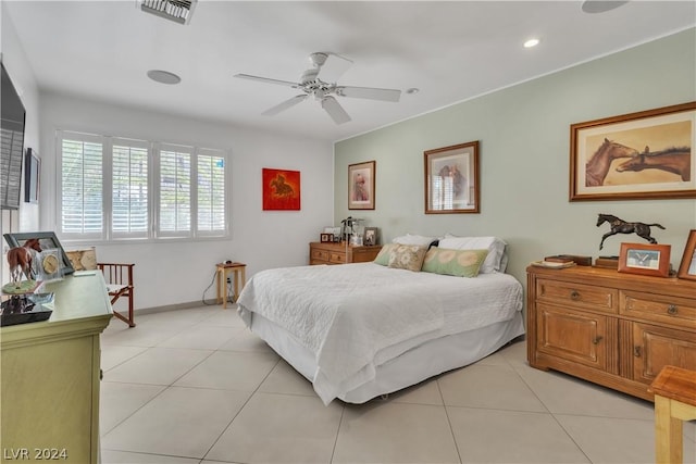 tiled bedroom featuring ceiling fan