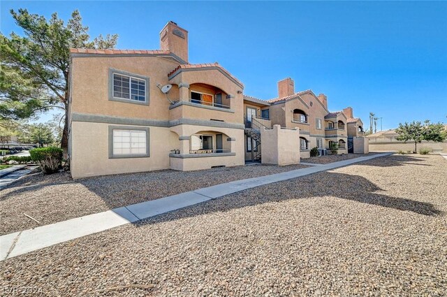 view of front of home with a balcony