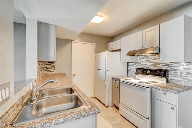 kitchen with backsplash, white appliances, sink, and white cabinets