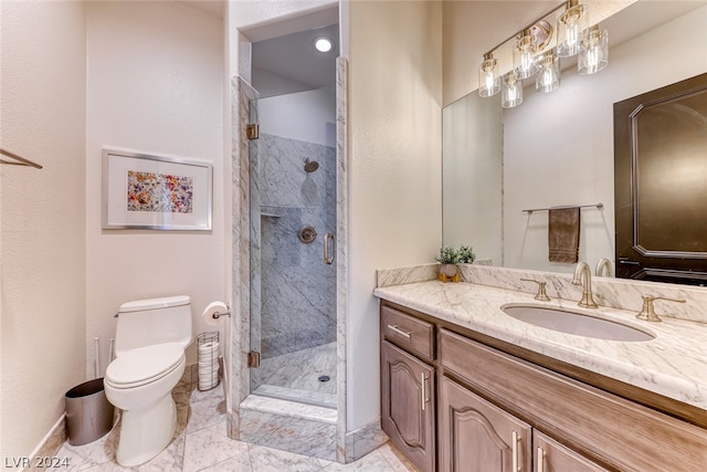 bathroom featuring walk in shower, vanity, toilet, and tile floors