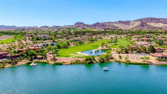 drone / aerial view with a water and mountain view