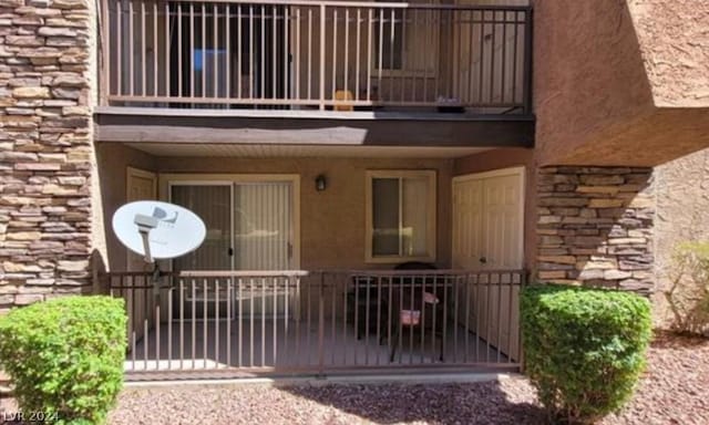 doorway to property with a balcony