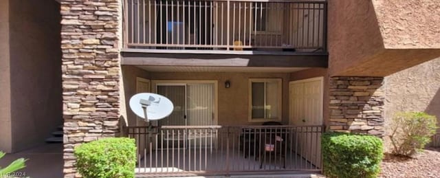 property entrance with a balcony