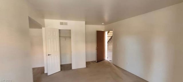 unfurnished bedroom with a closet