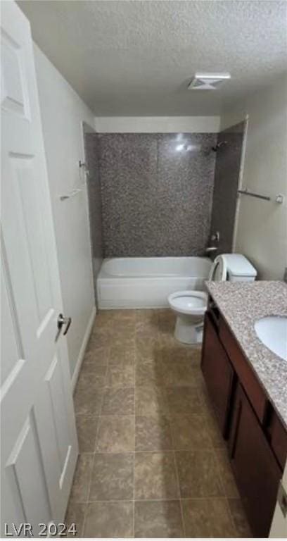 full bathroom with a textured ceiling, vanity, shower / bathtub combination, and toilet