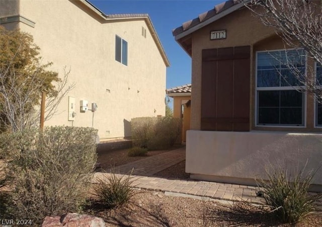 view of side of property with a patio area