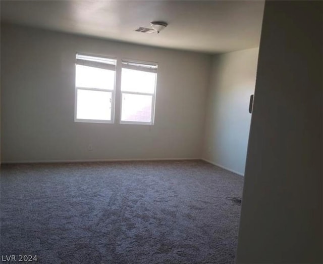 spare room with carpet flooring