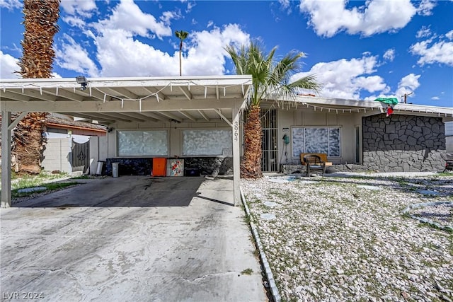 exterior space with a carport