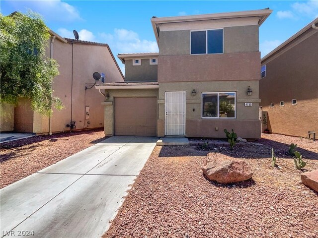 view of front of property featuring a garage