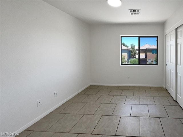 view of tiled spare room