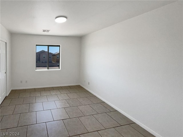 spare room featuring tile patterned floors