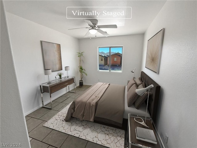 bedroom with ceiling fan and light tile patterned floors