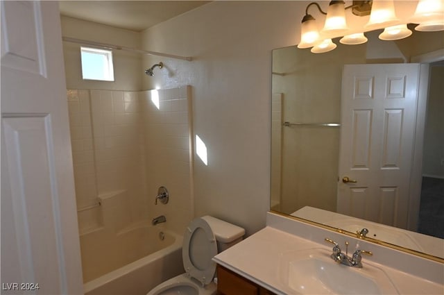 full bathroom featuring shower / tub combination, vanity, and toilet