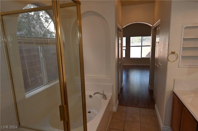 bathroom with vanity, tile patterned flooring, and shower with separate bathtub