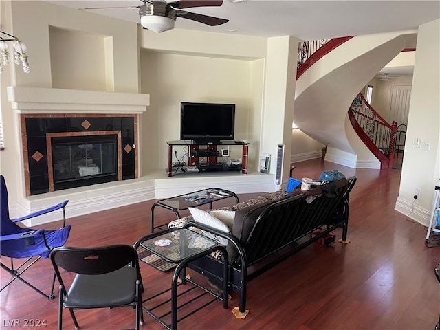 living room featuring a fireplace, ceiling fan, and hardwood / wood-style floors