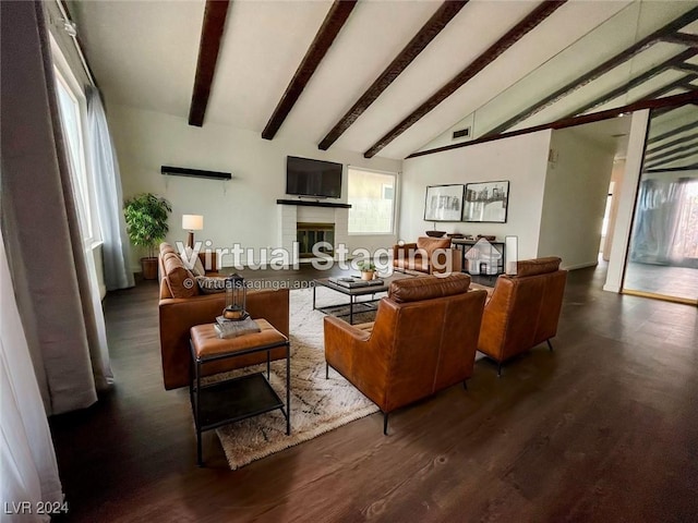 living room with a fireplace, dark hardwood / wood-style flooring, lofted ceiling with beams, and plenty of natural light