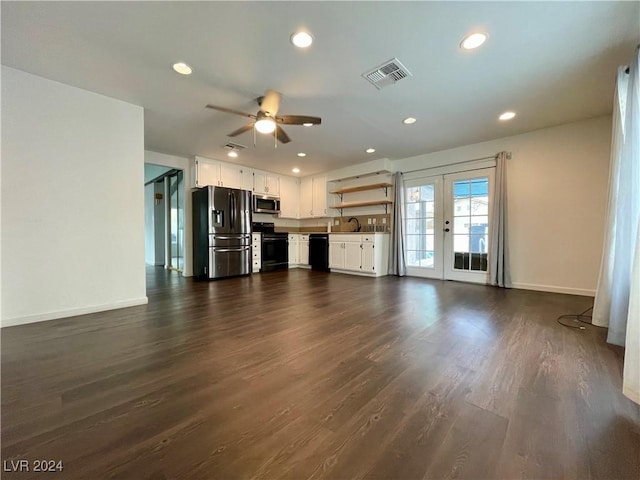 unfurnished living room featuring french doors, dark hardwood / wood-style floors, ceiling fan, and sink