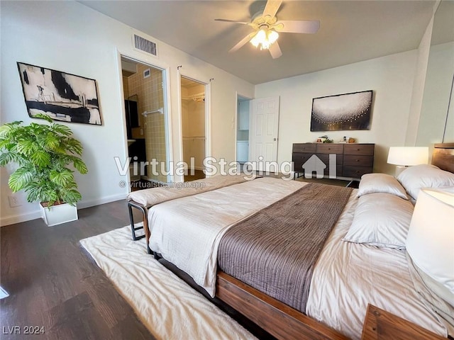 bedroom with dark hardwood / wood-style flooring, a spacious closet, a closet, and ceiling fan