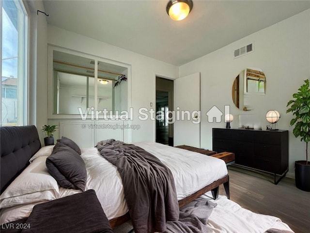 bedroom featuring dark hardwood / wood-style flooring