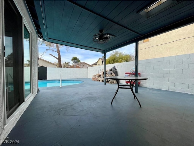 view of patio / terrace featuring a fenced in pool