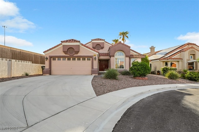 mediterranean / spanish-style house featuring a garage