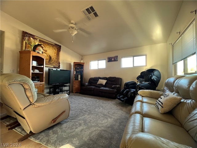 living room with ceiling fan and lofted ceiling