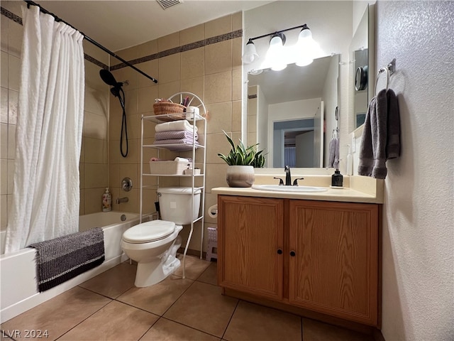 full bathroom featuring tile patterned flooring, shower / bath combo, toilet, and vanity