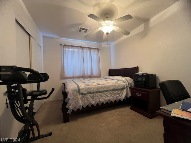 bedroom featuring a closet, carpet flooring, and ceiling fan