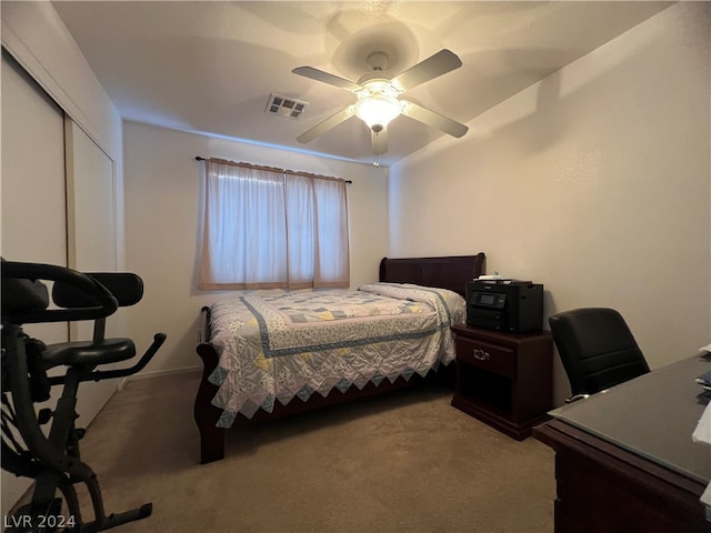 bedroom with a closet, carpet, and ceiling fan