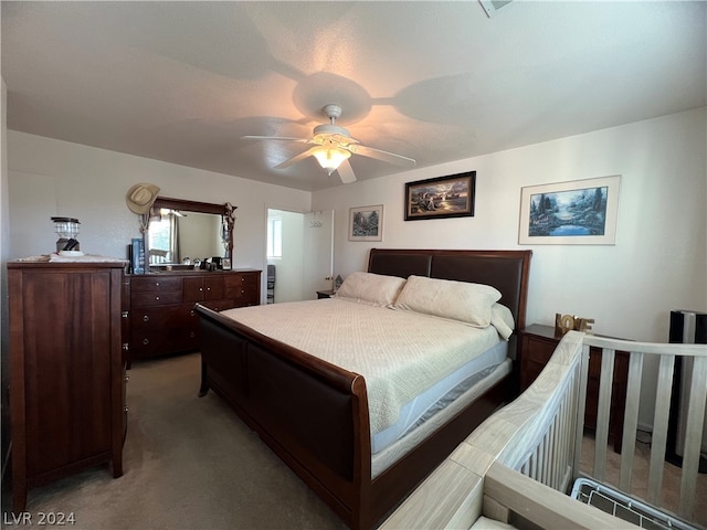 carpeted bedroom with ceiling fan